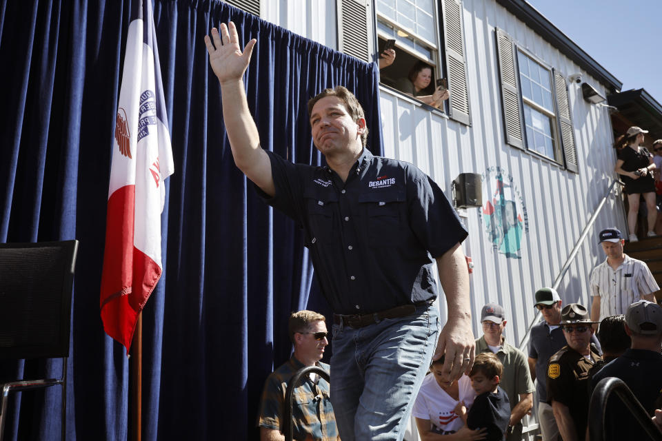 Florida Governor Ron DeSantis takes the stage during one of Iowa Governor Kim Reynolds' 