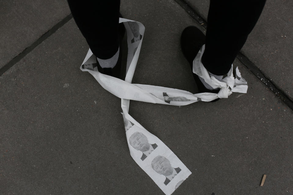 Toilet paper printed with President Donald Trump’s face is tied to a women’s leg at the Women’s Unity Rally in Foley Square, Manhattan in New York City, Jan. 19, 2019. (Photo: Gabriela Bhaskar/Reuters)