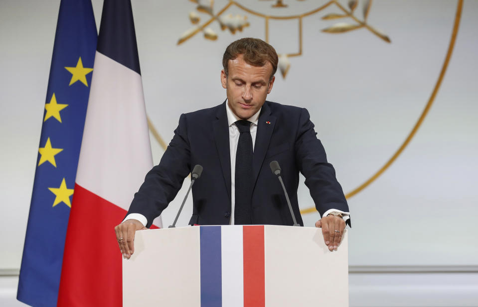 French President Emmanuel Macron pauses as he delivers a speech during a meeting in memory of the Algerians who fought alongside French colonial forces in Algeria's war, known as Harkis, at the Elysee Palace in Paris, Monday, Sept. 20, 2021. Macron's speech is the latest step in his efforts to reconcile France with its dark colonial past, especially in Algeria. (Gonzalo Fuentes/Pool Photo via AP)