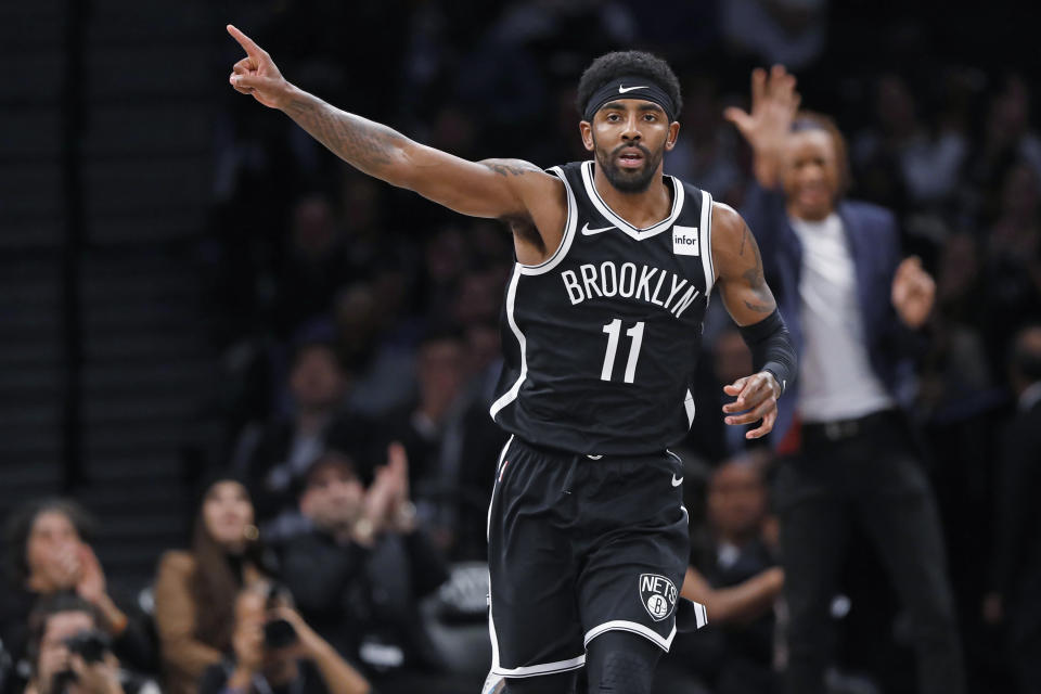 Brooklyn Nets guard Kyrie Irving (11) celebrates after scoring during the first half of the team's NBA basketball game against the Minnesota Timberwolves, Wednesday, Oct. 23, 2019, in New York. Irving had 50 points but the Nets fell to the Timberwolves in overtime, 127-126. (AP Photo/Kathy Willens)