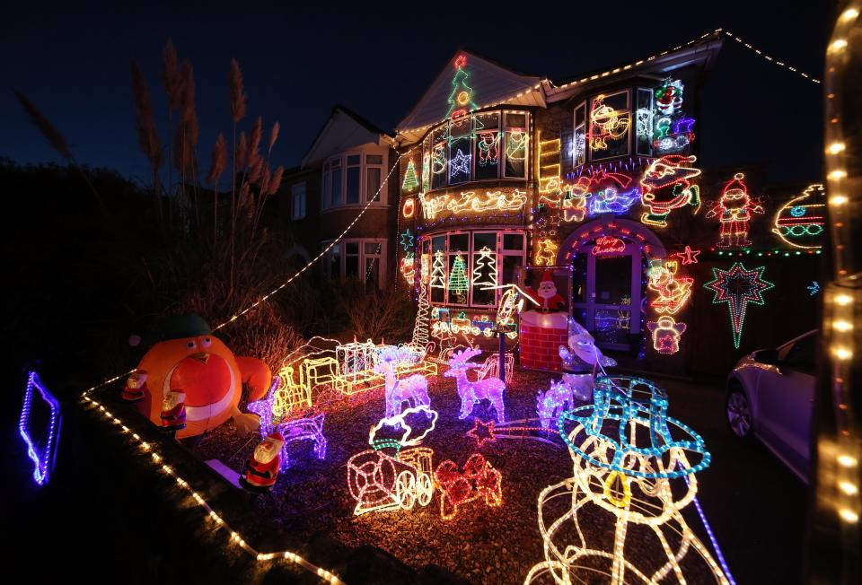 MELKSHAM, ENGLAND - DECEMBER 08: Christmas festive lights adorn a semi-detached house in a suburban street in Melksham, December 8, 2012 in Melksham, England. (Photo by Matt Cardy/Getty Images)