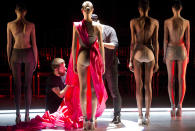 Models are dressed on stage to present the creation from the Fause Haten Summer collection during the Sao Paulo Fashion Week in Sao Paulo, Brazil, Wednesday, April 2, 2014. (AP Photo/Andre Penner)