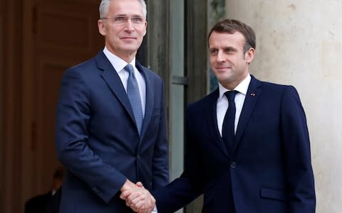French President Emmanuel Macron (R) welcomes Nato Secretary General Jens Stoltenberg at the Elysée Palace in Paris  - Credit: &nbsp;Chesnot/&nbsp;Getty Images Europe