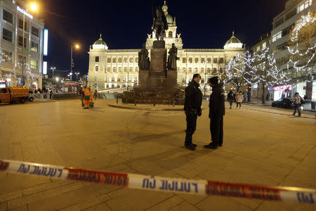 Police officers are seen at the scene where a man set himself on fire in downtown Prague, Czech Republic January 18, 2019. REUTERS/Milan Kamm