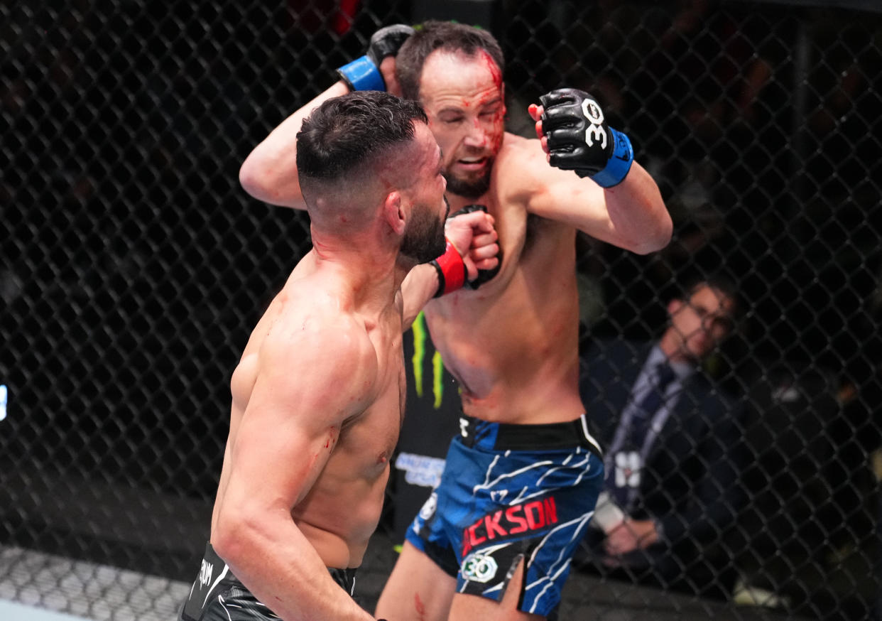 LAS VEGAS, NEVADA - JANUARY 14: (L-R) Dan Ige punches Damon Jackson in a featherweight fight during the UFC Fight Night event at UFC APEX on January 14, 2023 in Las Vegas, Nevada. (Photo by Chris Unger/Zuffa LLC via Getty Images)