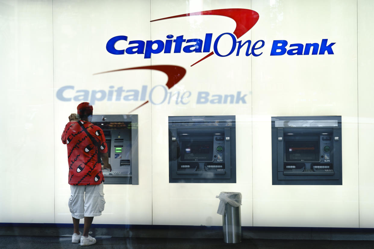 NEW YORK, NY - JULY 30: A man uses the ATM at a Capital One bank in Midtown Manhattan on July 30, 2019 in New York City. In one of the largest-ever thefts of bank data, a software engineer in Seattle was arrested for hacking into a Capitol One server and obtaining the personal data of over 100 million people. The data includes social security numbers, bank account numbers, names, addresses, credit scores, credit limits, balances, and other information. (Photo by Drew Angerer/Getty Images)