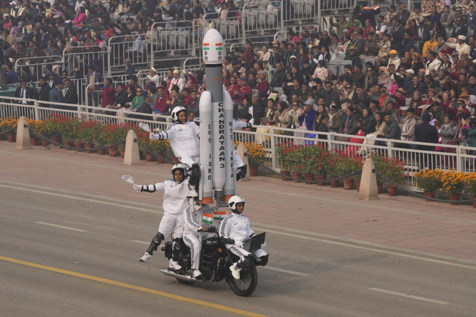 A group of female daredevils from the India armed forces performed stunts on a motorcycle on the ceremonial street Kartavyapath during India's Republic Day parade celebrations in New Delhi, India, Friday, Jan. 26, 2024. Thousands of people cheered a colorful parade showcasing India's military and cultural heritage on a ceremonial boulevard in New Delhi, braving winter chill and mist. (AP Photo/Manish Swarup)