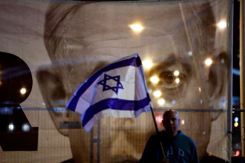 FILE PHOTO: Israelis protest Prime Minister Benjamin Netanyahu's new right-wing coalition and its proposed judicial reforms, in Tel Aviv