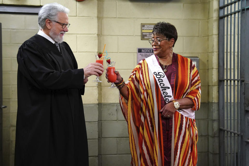 This image released by NBC shows John Larroquette as Dan Fielding, left, and Marsha Warfield as Roz in a scene from the "Night Court" episode entitled "The Roz Affair." (Nicole Weingart/NBC via AP)