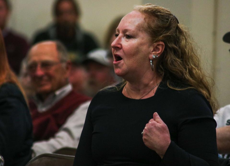 Jami White of Great Bend, Kansas, speaks passionately to the Kansas State Fair board about her personal connections to the historic dirt race track on the fairgrounds.