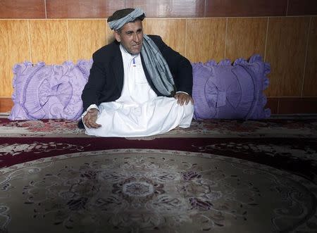 Khodaidad, the acting district chief of Khaki Safed, speaks during an interview at his house in Farah province February 3, 2015. REUTERS/Omar Sobhani