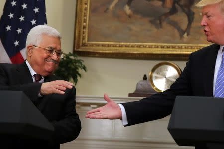 U.S. President Donald Trump shakes hands with Palestinian President Mahmoud Abbas as they deliver a statement at the White House in Washington D.C., U.S., May 3, 2017. REUTERS/Carlos Barria