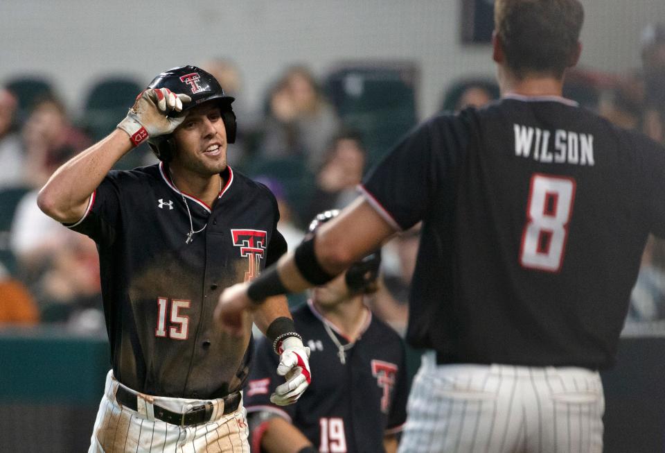 Texas Tech's Parker Kelly (15) stands up after sliding into home plate at the game against Kansas State in the first-round Big 12 tournament game, Wednesday, May 25, 2022, at Globe Life Field in Arlington. Tech won, 5-3.