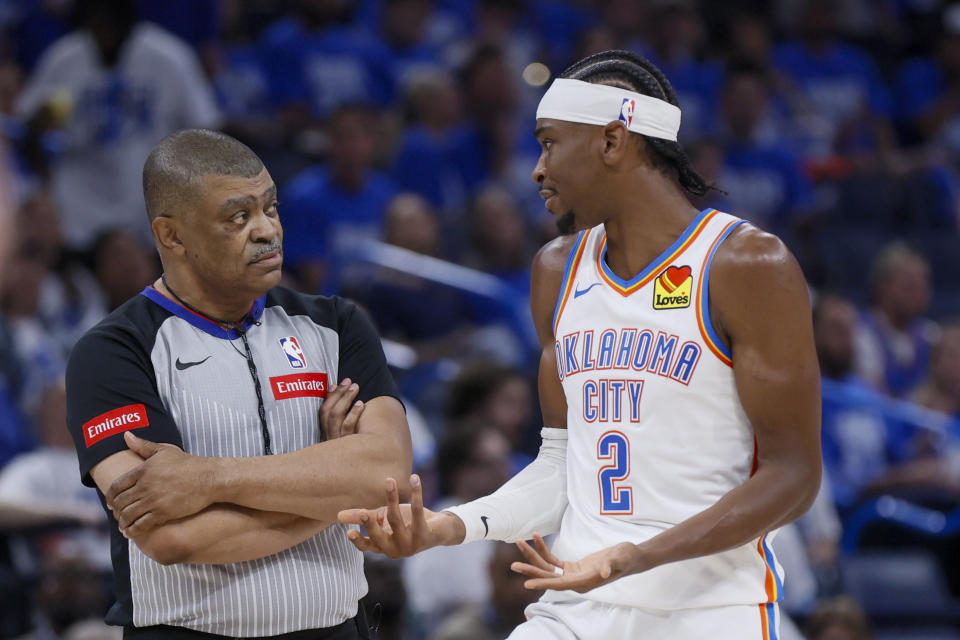 Oklahoma City Thunder guard Shai Gilgeous-Alexander (2) talks with official Tony Brothers during the second half of Game 1 of an NBA basketball second-round playoff series against the Dallas Mavericks, Tuesday, May 7, 2024, in Oklahoma City. (AP Photo/Nate Billings)