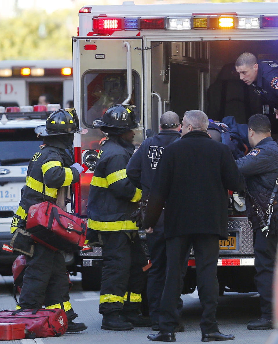 <p>Paramedics lift an individual into an ambulance near the scene after reports of a deadly shooting on Oct. 31, 2017, in New York. A motorist drove onto a busy bicycle path near the World Trade Center memorial and struck several people Tuesday, police and witnesses said. (Photo: Bebeto Matthews/AP) </p>