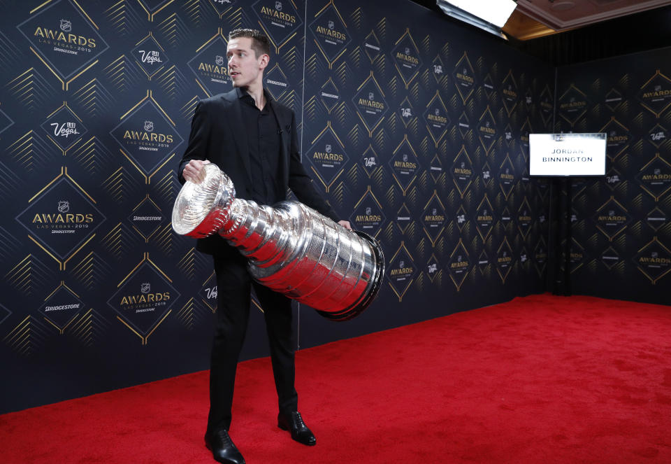 Jordan Binnington of the St. Louis Blues holds the Stanley Cup on the red carpet before the NHL Awards, Wednesday, June 19, 2019, in Las Vegas. (AP Photo/John Locher)