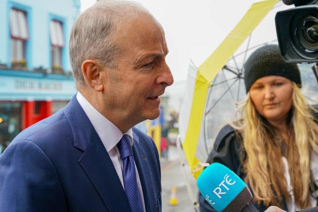 Tanaiste Micheal Martin speaking to the media following the funeral