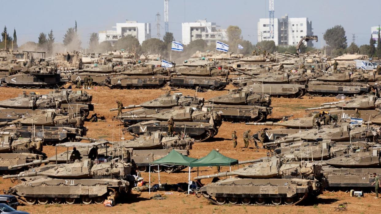 PHOTO: Israeli soldiers stand next to military vehicles, amid the ongoing conflict between Israel and the Palestinian Islamist group Hamas, near the Israel-Gaza Border, in southern Israel, May 7, 2024.  (Amir Cohen/Reuters)