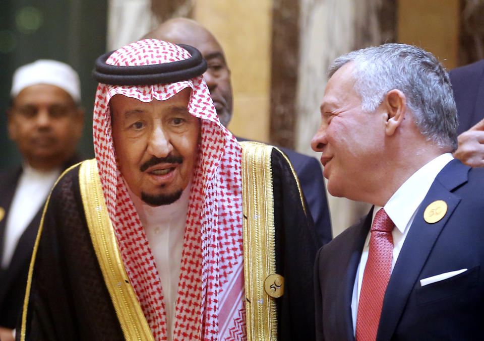 Jordan's King Abdullah II, right, talks to Saudi King Salman during a group picture ahead of Islamic Summit of the Organization of Islamic Cooperation (OIC) in Mecca, Saudi Arabia, early Saturday, June 1, 2019. Muslim leaders from some 57 nations gathered in Islam's holiest city of Mecca late Friday to discuss a breadth of critical issues ranging from a spike in tensions in the Persian Gulf, to Palestinian statehood, the plight of Rohingya refugees and the growing threat of Islamophobia. (AP Photo/Amr Nabil)