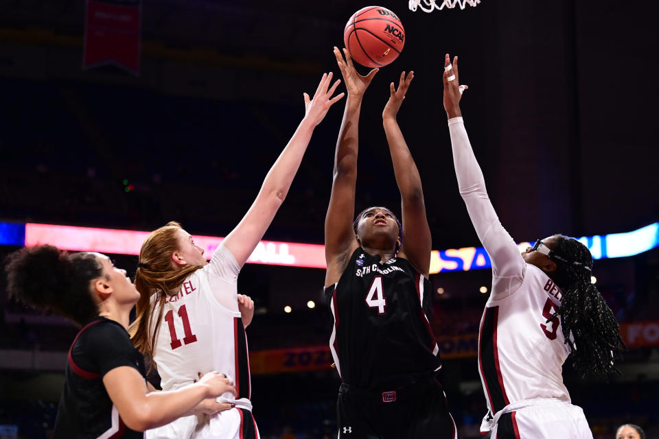 Aliyah Boston of South Carolina shoots between Ashten Prechtel and Francesca Belibi of Stanford.