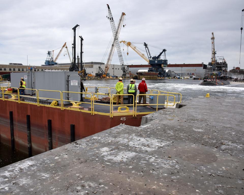 The USS Cheyenne (SSN 773) makes history as she becomes the first submarine to utilize the super flood basin and enter Dry Dock 1 without the use of ballast tanks.