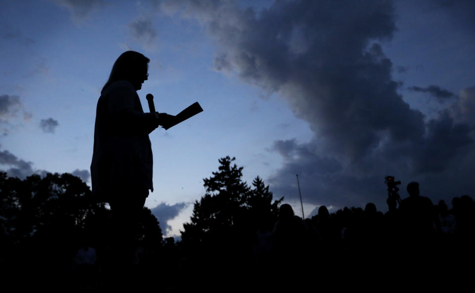 Iowa State women's golf coach Christie Martens speaks during a vigil for slain Iowa State student Celia Barquin Arozamena, Wednesday, Sept. 19, 2018, in Ames, Iowa. Barquin, who was the 2018 Big 12 women's golf champion and Iowa State Female Athlete of the Year, was found Monday morning in a pond at a golf course near the Iowa State campus. (AP Photo/Charlie Neibergall)