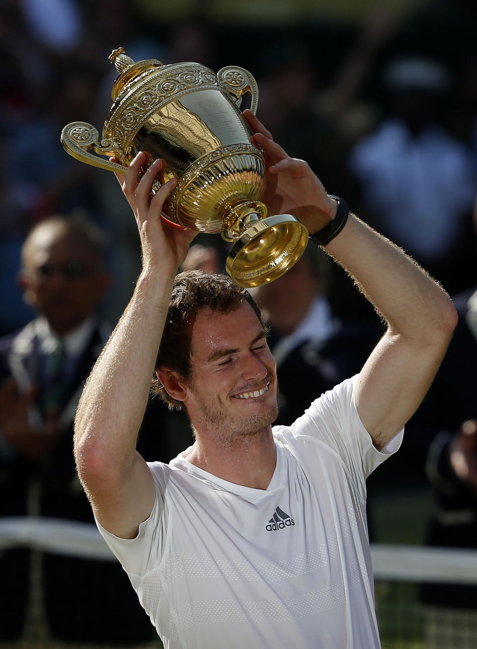 Great Britain's Andy Murray celebrates with the trophy after defeating Serbia's Novak Djokovic in the Men's Final during day thirteen of the Wimbledon Championships at The All England Lawn Tennis and Croquet Club, Wimbledon.