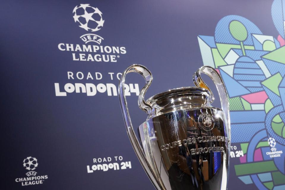 The Uefa Champions League trophy at the last 16 draw in Nyon, Switzerland (AP)