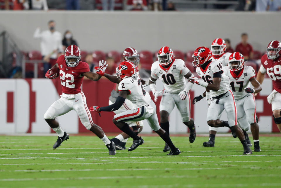 Najee Harris blocks during a run in the first half against Georgia.