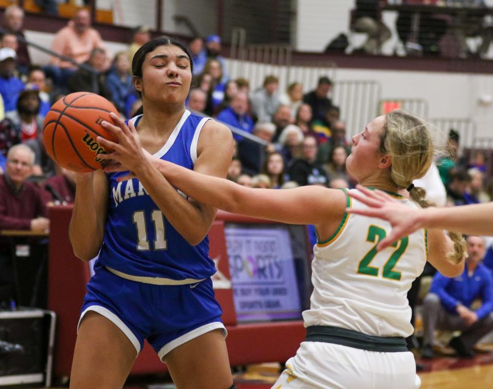 Mishawaka Marian's MaKaya Porter (11) is pressured by Tippecanoe Valley's Kaydence Mellott (22) during the IHSAA Regional Finals Saturday, Feb. 11, 2023 at Jimtown High School.