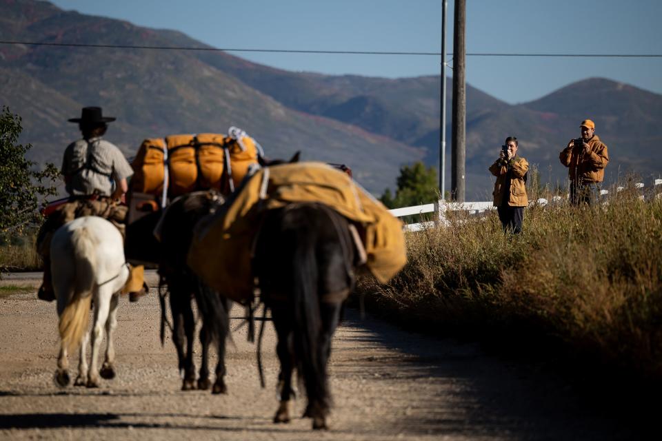 Daniel Harvath and his wife, Leah, take photos and video as their son, Jake Harvath, sets out on a yearlong horse ride across the country at Sage Creek Equestrian in Charleston, Wasatch County, on Monday, Sept. 25, 2023. | Spenser Heaps, Deseret News