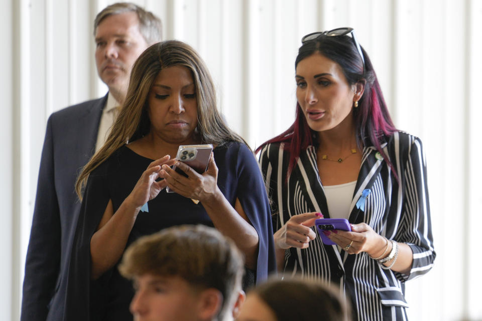 Lynne Patton and Laura Loomer watch as Republican presidential nominee former President Donald Trump visits the Shanksville Volunteer Fire Company in Shanksville, Pa., Wednesday, Sept. 11, 2024. (AP Photo/Matt Rourke)