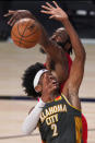 Oklahoma City Thunder's Shai Gilgeous-Alexander (2) has his shot blocked by Houston Rockets' James Harden, rear, during the second half of an NBA first-round playoff basketball game, Monday, Aug. 31, 2020, in Lake Buena Vista, Fla. (AP Photo/Mark J. Terrill)