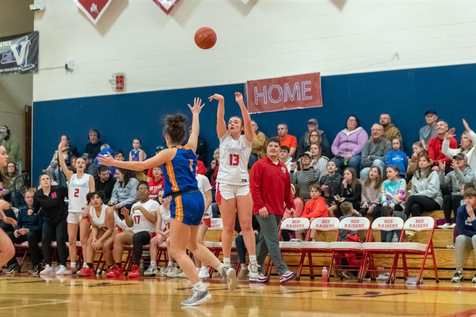 Raegan Evingham hits a three in front of the bench as Hornell coach Jim Dagon looks on Saturday during the Section V playoff win over Livonia. Evingham led Hornell with 19 points and six rebounds.