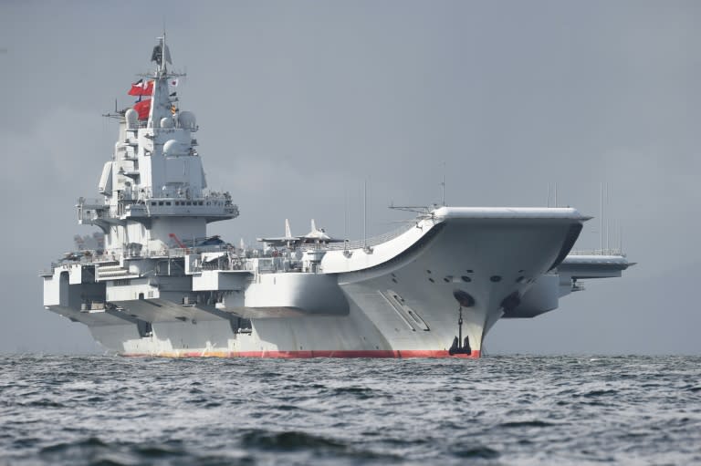 China's sole aircraft carrier, the Liaoning, took part in military drills Friday, the Chinese navy said, ramping up tensions with Taiwan