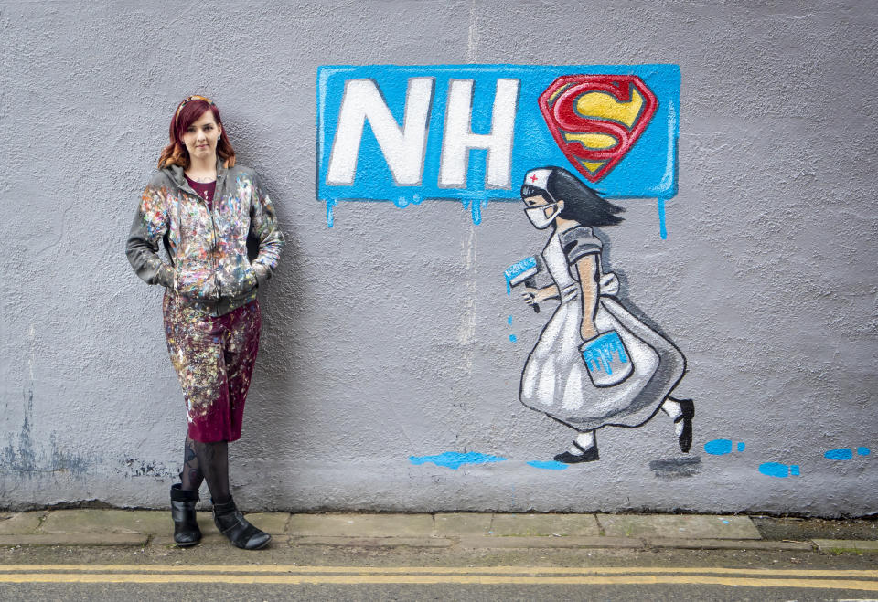 Artist Rachel List with her mural supporting the NHS on the side of Horse Vaults pub in Pontefract, Yorkshire, as the UK continues in lockdown to help curb the spread of the coronavirus.