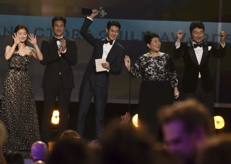 Park So-dam, from left, Lee Sun Gyun, Choi Woo-shik, Lee Jeong-eun and Kang-Ho Song accept the award for outstanding performance by a cast in a motion picture for "Parasite" at the 26th annual Screen Actors Guild Awards at the Shrine Auditorium & Expo Hall on Sunday, Jan. 19, 2020, in Los Angeles. (AP Photo/Chris Pizzello)