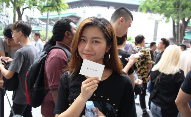 Singapore Polytechnic student Huang Xiao Yue queueing up to enter the Louis Vuitton boutique at ION Orchard. (Photo: Yahoo Lifestyle Singapore)