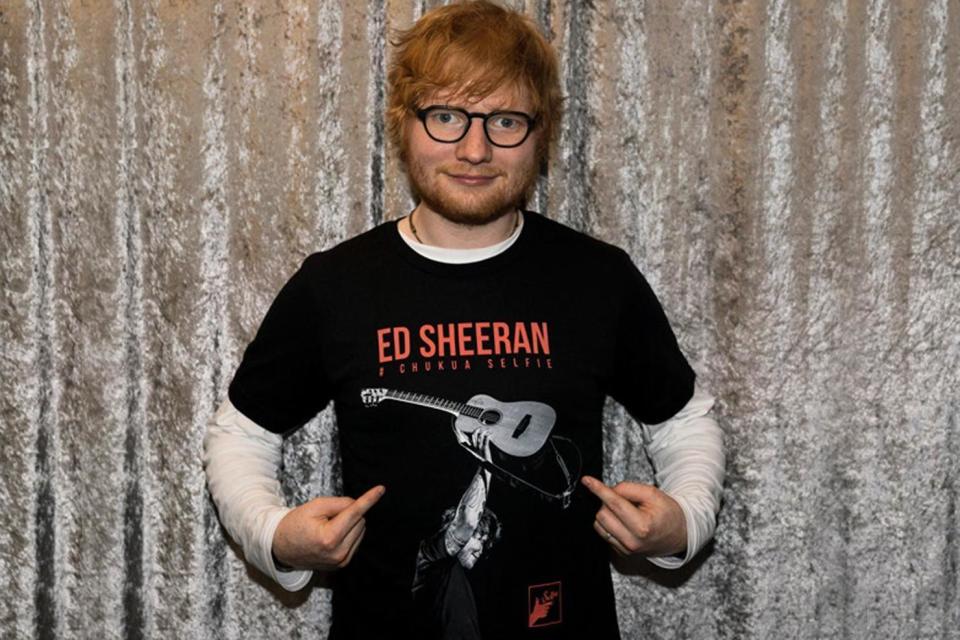Teed up: Ed Sheeran wears the shirt that he designed to raise funds for the Chukua Selfie project