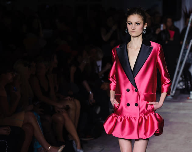 <b>London Fashion Week AW13: Moschino Cheap & Chic AW13</b><br><br>A twist on the tux jacket came in the form of this pink and black jacket, with a peplum base and pockets.<br><br>©Rex<br>