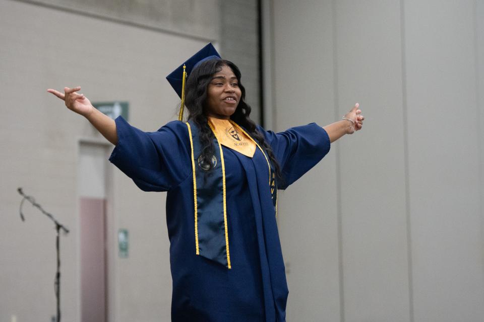 Neveah Brown celebrates after her Navy Enlistment Swearing In during Academy @ Shawnee's graduation ceremony at the Kentucky Expo Center on Friday, May 24, 2024.
