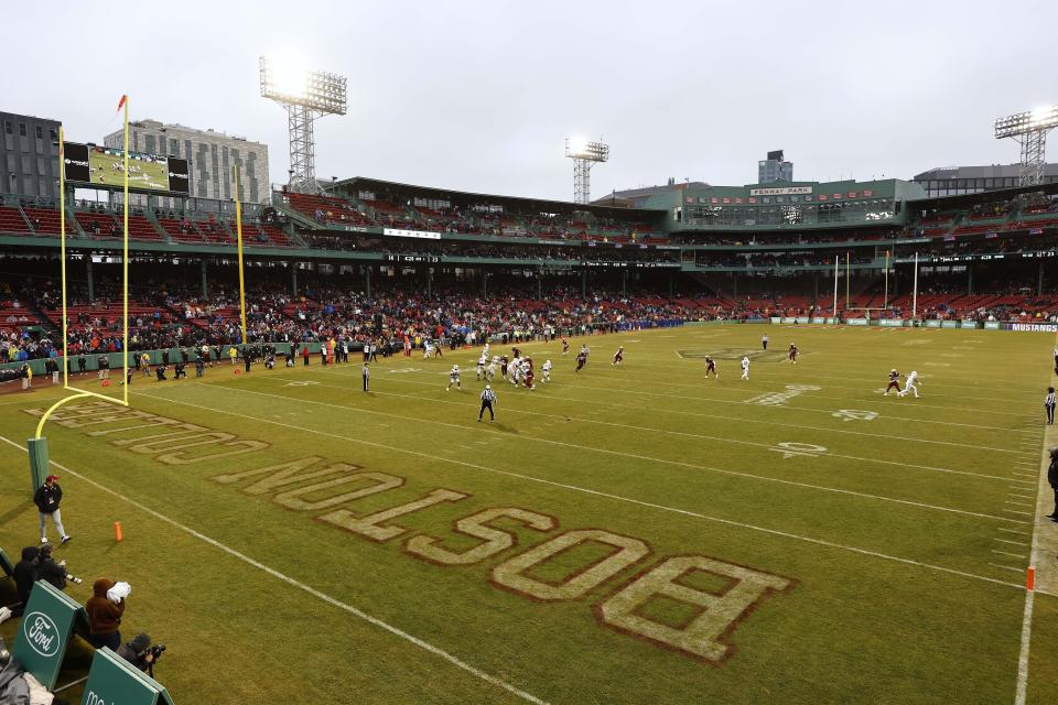 FILE - Boston College play SMU during the first half of the Fenway Bowl NCAA football game at Fenway Park Thursday, Dec. 28, 2023, in Boston. With the expanded College Football Playoff locked in through 2031, questions still remain about what the rest of the postseason will look like. One thing is certain, there will still be bowl games. (AP Photo/Winslow Townson, File)