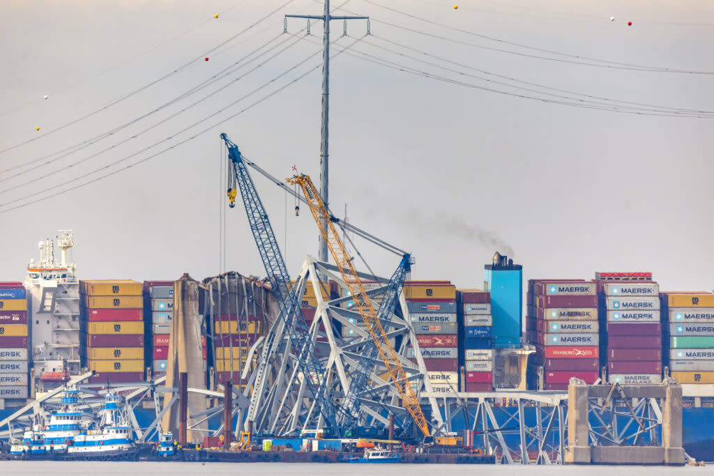 Debris is cleared from the collapsed Francis Scott Key Bridge as efforts begin to reopen the Port of Baltimore on March 31, 2024, in Baltimore, Maryland.