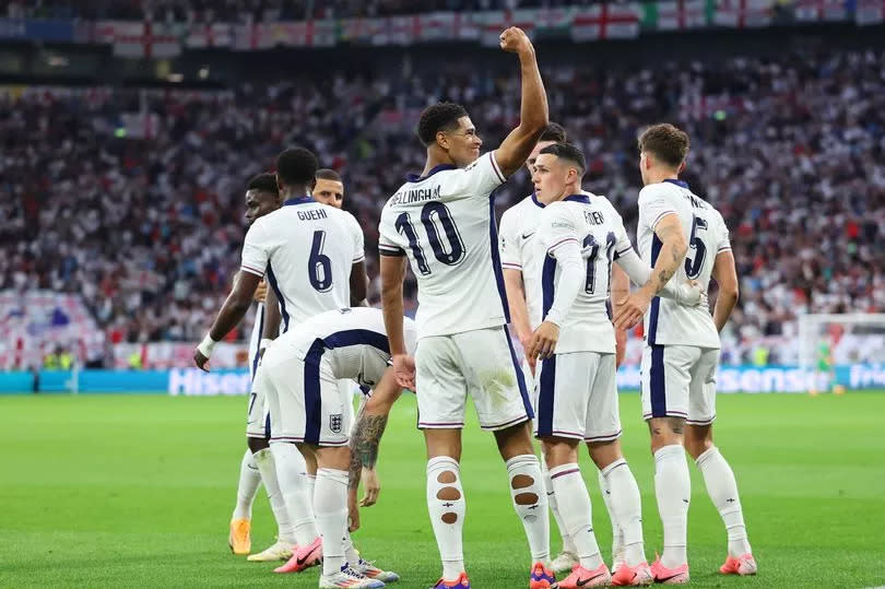 Jude Bellingham of England celebrates with teammates after scoring his team's first goal in Euro2024