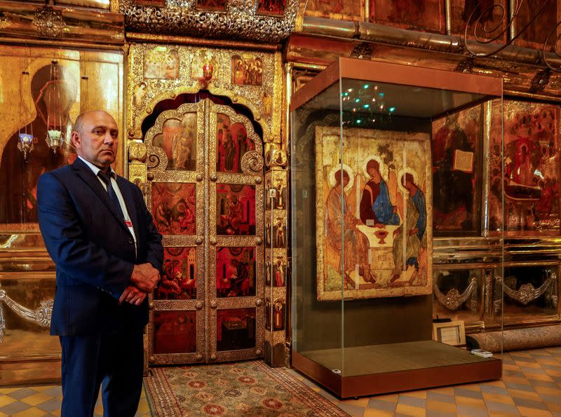 FILE PHOTO: A security guard stands next to the Trinity icon at a cathedral in Sergiyev Posad