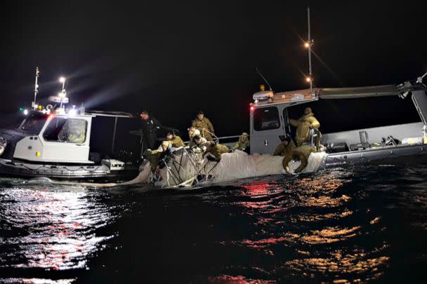 PHOTO: Sailors assigned to Explosive Ordnance Disposal Group 2 recover a high-altitude surveillance balloon off the coast of Myrtle Beach, S.C., Feb. 5, 2023, after it was shot down. (Department of Defense)