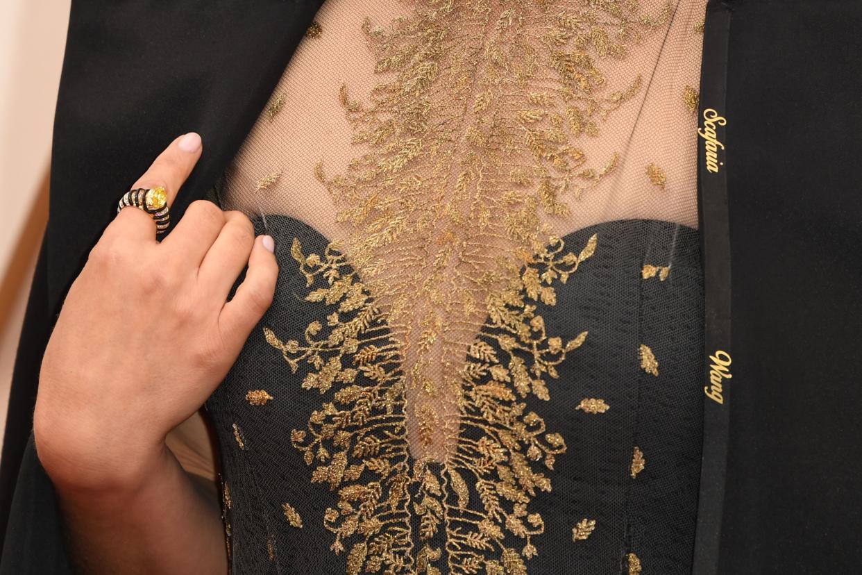 US-Israeli actress Natalie Portman wears a cape with the names of female film directors who were not nominated for Oscars as she arrives for the 92nd Oscars at the Dolby Theatre in Hollywood, California on February 9, 2020. (Photo by Robyn Beck / AFP) (Photo by ROBYN BECK/AFP via Getty Images)