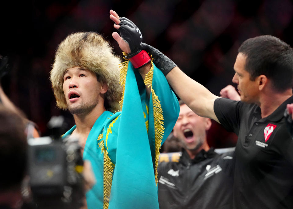 Dec 16, 2023; Las Vegas, Nevada, USA; Shavkat Rakhmonov (red gloves) reacts after defeating Stephen Thompson (blue gloves) during UFC 296 at T-Mobile Arena. Mandatory Credit: Stephen R. Sylvanie-USA TODAY Sports