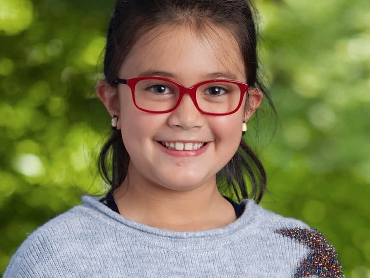 Sarah Jackson, 7, is four feet two inches tall, weighs about 76 pounds and has long, waist-length brown hair that's all one length. She has brown/hazel-coloured eyes and was last seen wearing teal-coloured eyeglasses. Her mother is calling on RCMP to issue an Amber Alert. (Submitted by Saskatchewan RCMP - image credit)