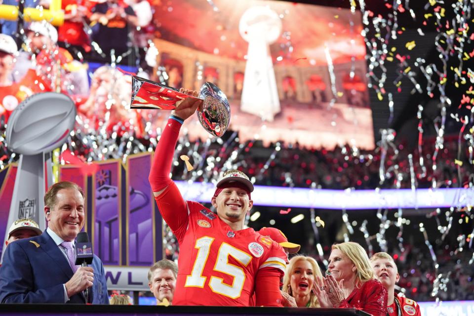 Patrick Mahomes lifts the Vince Lombardi Trophy after winning Super Bowl 58.